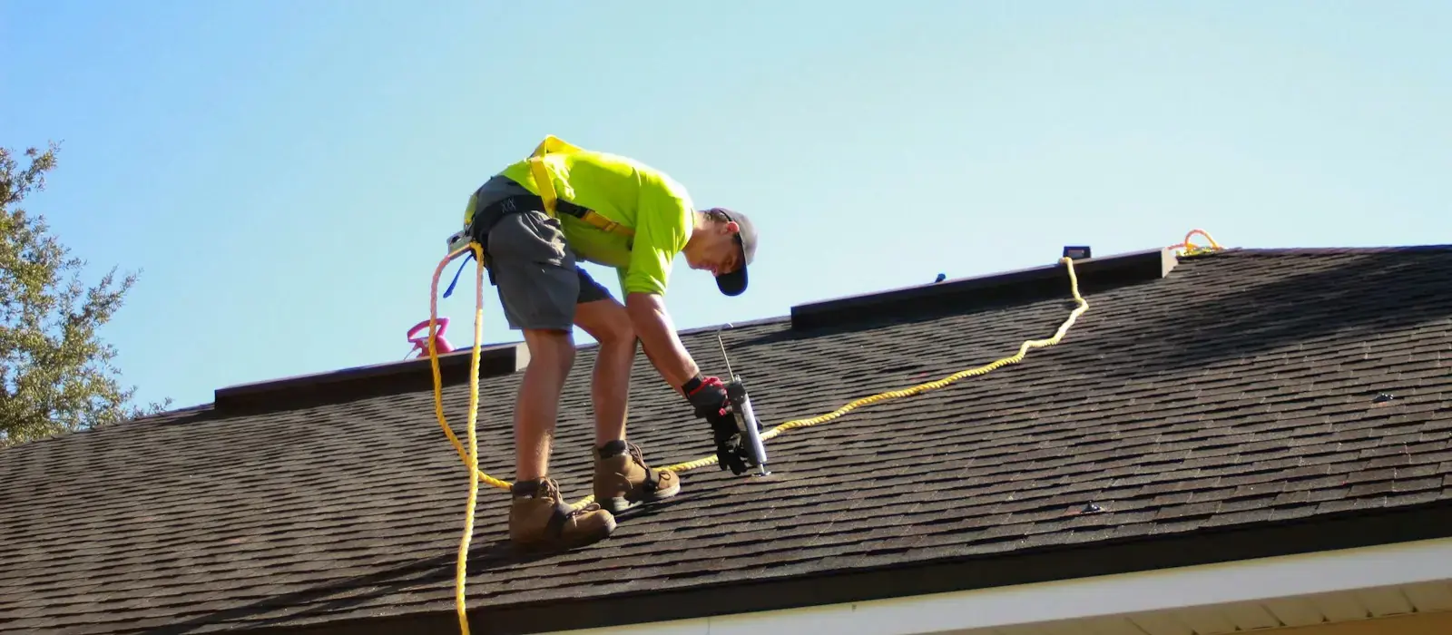 Roofing installation with shingles and tools